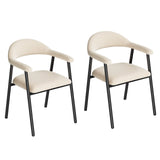 Twee beige eetkamerstoelen met gebogen armleuningen, open rug en donkere metalen poten