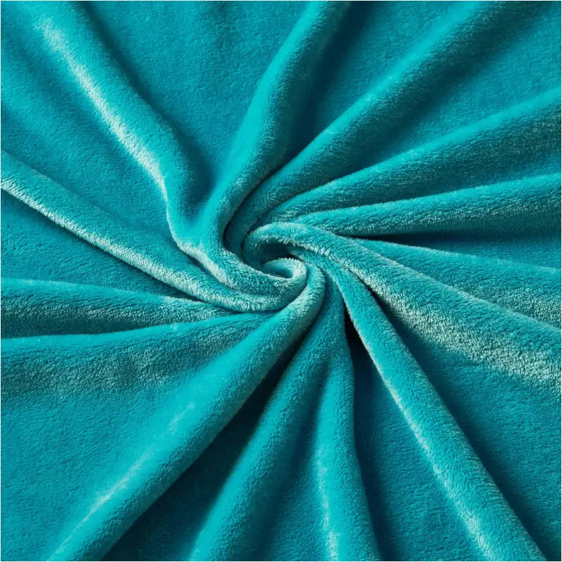 BukkitBow flanellen deken 260 GSM, zacht en warm, in verschillende maten en kleuren, op een bed gelegd.