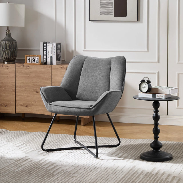 Moderne linnen fauteuil van BukkitBow met X-vormig onderstel, elegant en comfortabel voor in de woonkamer.