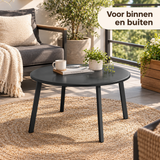 ronde salontafel zwart metaal in gebruik in een passende praktijksituatie